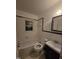 The bathroom offers a bathtub, toilet, vanity with sink, and a window at 2219 Fitzgerald Ave, Durham, NC 27707