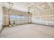 Spacious two-car garage with ample room for parking and storage. Drywall incomplete at 2229 Abbeyhill Dr # 123, Raleigh, NC 27610