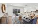 Spacious living room with hardwood floors, sofa, and sliding door that accesses the covered patio at 2229 Abbeyhill Dr # 123, Raleigh, NC 27610