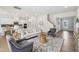 Bright living room with hardwood floors, neutral furniture, and seamlessly connects to the kitchen at 2229 Abbeyhill Dr # 123, Raleigh, NC 27610