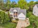 A high angle of a landscaped two-story home with mature trees and a well-maintained lawn at 3236 Forest Mill Cir, Raleigh, NC 27616