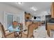 Breakfast nook with a glass table and four chairs, with views of the kitchen at 3236 Forest Mill Cir, Raleigh, NC 27616