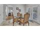 Elegant dining area with glass table and doors leading to the backyard at 3236 Forest Mill Cir, Raleigh, NC 27616
