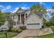 Inviting two-story home with white siding, brick accents, and a well-manicured front lawn at 3236 Forest Mill Cir, Raleigh, NC 27616