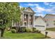 Charming two-story home with a well-manicured lawn, a front porch, and a two-car garage at 3236 Forest Mill Cir, Raleigh, NC 27616