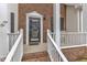 Welcoming front porch with brick accents, white railings, and views of the front yard at 3236 Forest Mill Cir, Raleigh, NC 27616
