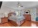 Comfortable main bedroom with wood floors, stylish furniture, and a ceiling fan at 3236 Forest Mill Cir, Raleigh, NC 27616