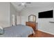 Well-lit main bedroom offering hardwood floors and a vaulted ceiling, providing a comfortable and stylish space at 3236 Forest Mill Cir, Raleigh, NC 27616