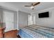 The Main Bedroom features a ceiling fan, wood floor, and access to the en-suite bathroom at 3236 Forest Mill Cir, Raleigh, NC 27616