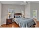 Comfortable main bedroom featuring hardwood floors and neutral tones, creating a serene and relaxing retreat at 3236 Forest Mill Cir, Raleigh, NC 27616