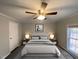 Bright bedroom with ceiling fan and large window at 5068 Dorsey Rd, Oxford, NC 27565