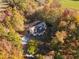 Aerial view of a house nestled in autumn foliage at 7039 Old 421 Rd, Liberty, NC 27298