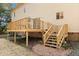 Spacious back deck with wooden rails and stairs leading to a well-maintained backyard space at 7039 Old 421 Rd, Liberty, NC 27298