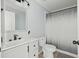 Contemporary bathroom featuring gray vanity, black fixtures, and a shower/tub with modern curtain at 7039 Old 421 Rd, Liberty, NC 27298