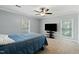 Inviting bedroom with a large window, ceiling fan, and plush carpeting for ultimate comfort at 7039 Old 421 Rd, Liberty, NC 27298
