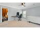 The bedroom features a fan, natural light, and ample space creates a comfortable and inviting atmosphere at 7039 Old 421 Rd, Liberty, NC 27298