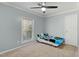 Comfortable bedroom with a ceiling fan, window, and neutral carpet creating a cozy atmosphere at 7039 Old 421 Rd, Liberty, NC 27298