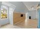 Bright bonus room featuring wood accent wall, lots of light, perfect for entertainment and relaxation at 7039 Old 421 Rd, Liberty, NC 27298