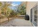 Back deck with a grill and wooded view at 7039 Old 421 Rd, Liberty, NC 27298