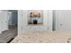 Bright kitchen with white cabinets, granite countertops, coffee bar, and stainless appliances at 7039 Old 421 Rd, Liberty, NC 27298