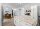 Open-concept kitchen and dining area with white cabinets and granite countertops at 7039 Old 421 Rd, Liberty, NC 27298