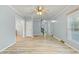 Expansive open-concept living room featuring wood floors, crown molding, and neutral paint at 7039 Old 421 Rd, Liberty, NC 27298