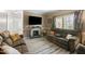 Cozy living room with stone fireplace, wall mounted television and ample seating for Gathering and friends at 7039 Old 421 Rd, Liberty, NC 27298