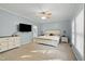 Spacious main bedroom with a ceiling fan, plush carpet, and lots of natural light from large window at 7039 Old 421 Rd, Liberty, NC 27298