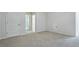 Bright bedroom with neutral carpet and walls and access to a full bathroom at 7529 Percussion Dr, Apex, NC 27539