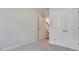 Bedroom with closet and an open doorway with view of stairs at 7529 Percussion Dr, Apex, NC 27539