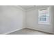 Neutral bedroom featuring ample natural light and white trim at 7529 Percussion Dr, Apex, NC 27539
