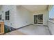 View of the covered patio, seamlessly extending living space outdoors with access to the backyard at 7529 Percussion Dr, Apex, NC 27539