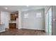 Living room with luxury vinyl plank flooring, neutral walls, and recessed lighting at 7529 Percussion Dr, Apex, NC 27539