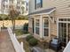Inviting front entrance with a black door, wreath, bay window, and outdoor seating area at 1120 Renewal Place # 108, Raleigh, NC 27603