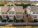 Charming townhomes featuring manicured lawns, picket fences, and tree-lined street, ideal for suburban living at 1120 Renewal Place # 108, Raleigh, NC 27603