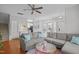 Spacious living room with a large sectional sofa, wood floors, and open access to the kitchen at 1120 Renewal Place # 108, Raleigh, NC 27603