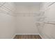 Spacious walk-in closet with plenty of wire rack shelving and wood floor at 1120 Renewal Place # 108, Raleigh, NC 27603
