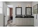 Bathroom featuring a double vanity, modern mirrors and fixtures, and access to the bedroom at 1204 Holding Village Way, Wake Forest, NC 27587