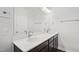 Elegant bathroom featuring double sinks, modern fixtures, vanity and a large mirror at 1204 Holding Village Way, Wake Forest, NC 27587