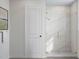 Modern bathroom with a glass enclosed shower and stylish fixtures and towel rack at 1204 Holding Village Way, Wake Forest, NC 27587