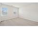 Cozy bedroom with neutral carpeting and two bright windows, offering a comfortable and serene space at 1204 Holding Village Way, Wake Forest, NC 27587