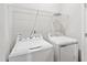 Functional laundry area features a washer, dryer, and wire shelving for organized storage at 1204 Holding Village Way, Wake Forest, NC 27587