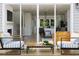 Relaxing outdoor patio with comfortable seating that offers views to the indoor living spaces through sliding glass doors at 1204 Holding Village Way, Wake Forest, NC 27587
