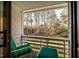 Private balcony with wooded views and comfortable seating at 135 Weatherbend, Pittsboro, NC 27312