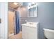 Simple bathroom with shower and white vanity at 135 Weatherbend, Pittsboro, NC 27312