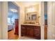Bathroom featuring vanity with granite countertop and open doorway to bedroom at 135 Weatherbend, Pittsboro, NC 27312
