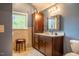 Bathroom with dark brown vanity, tile floor, and shower at 135 Weatherbend, Pittsboro, NC 27312