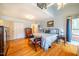Bright bedroom with hardwood floors, large bed, and ample closet space at 135 Weatherbend, Pittsboro, NC 27312