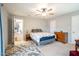 Cozy bedroom with floral bedding and ensuite bathroom access at 135 Weatherbend, Pittsboro, NC 27312