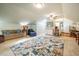 Spacious bonus room with kitchenette and large area rug at 135 Weatherbend, Pittsboro, NC 27312